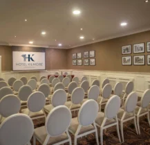 Elegant conference room at Hotel Kilmore with stylish seating and ambient lighting.