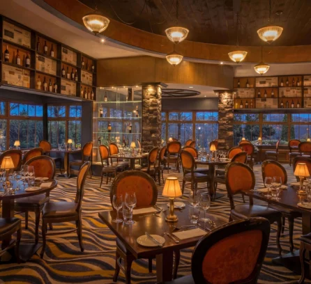 Elegant restaurant interior with soft lighting and tables set for a family dinner.