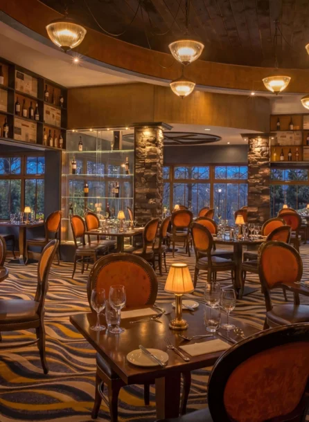 Elegant restaurant interior with soft lighting and tables set for a family dinner.