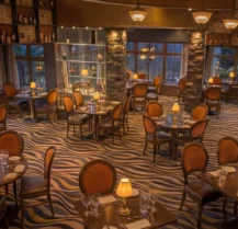 Elegant dining room at Hotel Kilmore with intimate lighting and cosy seating for families.