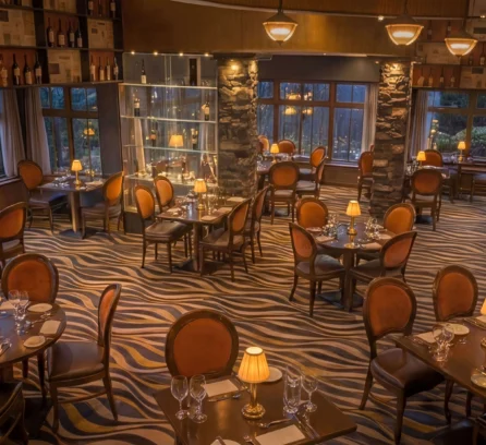 Elegant dining room at Hotel Kilmore with intimate lighting and cosy seating for families.