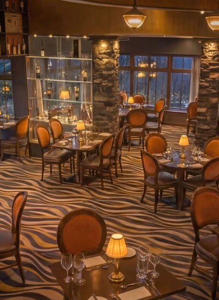 Elegant dining room at Hotel Kilmore with intimate lighting and cosy seating for families.