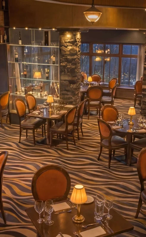 Elegant dining room at Hotel Kilmore with intimate lighting and cosy seating for families.