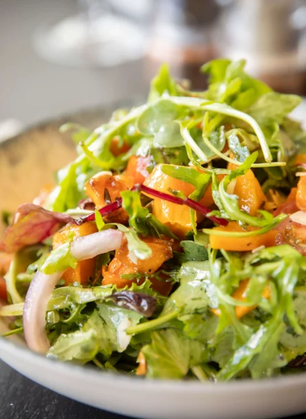 Fresh salad with vibrant greens and cherry tomatoes at Hotel Kilmore restaurant.
