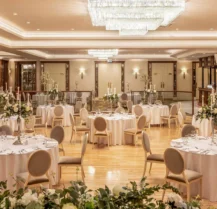 Elegant wedding reception setup at Hotel Kilmore with round tables and floral centrepieces.