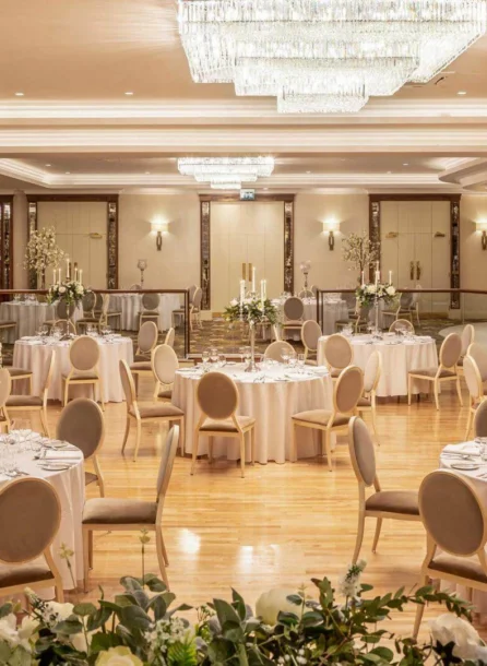 Elegant wedding reception setup at Hotel Kilmore with round tables and floral centrepieces.