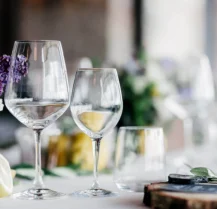 Elegant dining table with wine glasses and floral centrepieces at Hotel Kilmore.