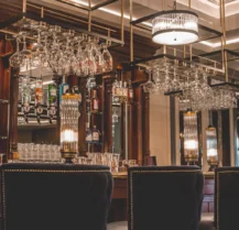 Elegant hotel bar with classic decor, welcoming guests for a cosy evening.