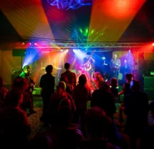 Guests enjoying live music and vibrant lights at Hotel Kilmore event.