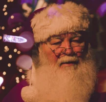 Santa Claus with festive lights, creating a warm festive atmosphere.