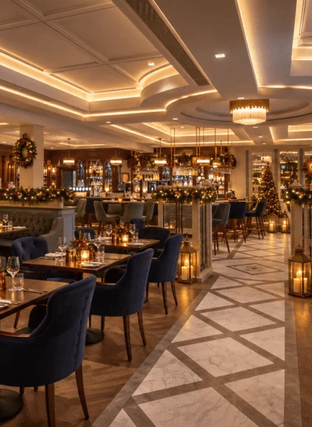 Warm, festive hotel dining area with a family enjoying a cosy dinner amidst elegant decor and soft lighting.